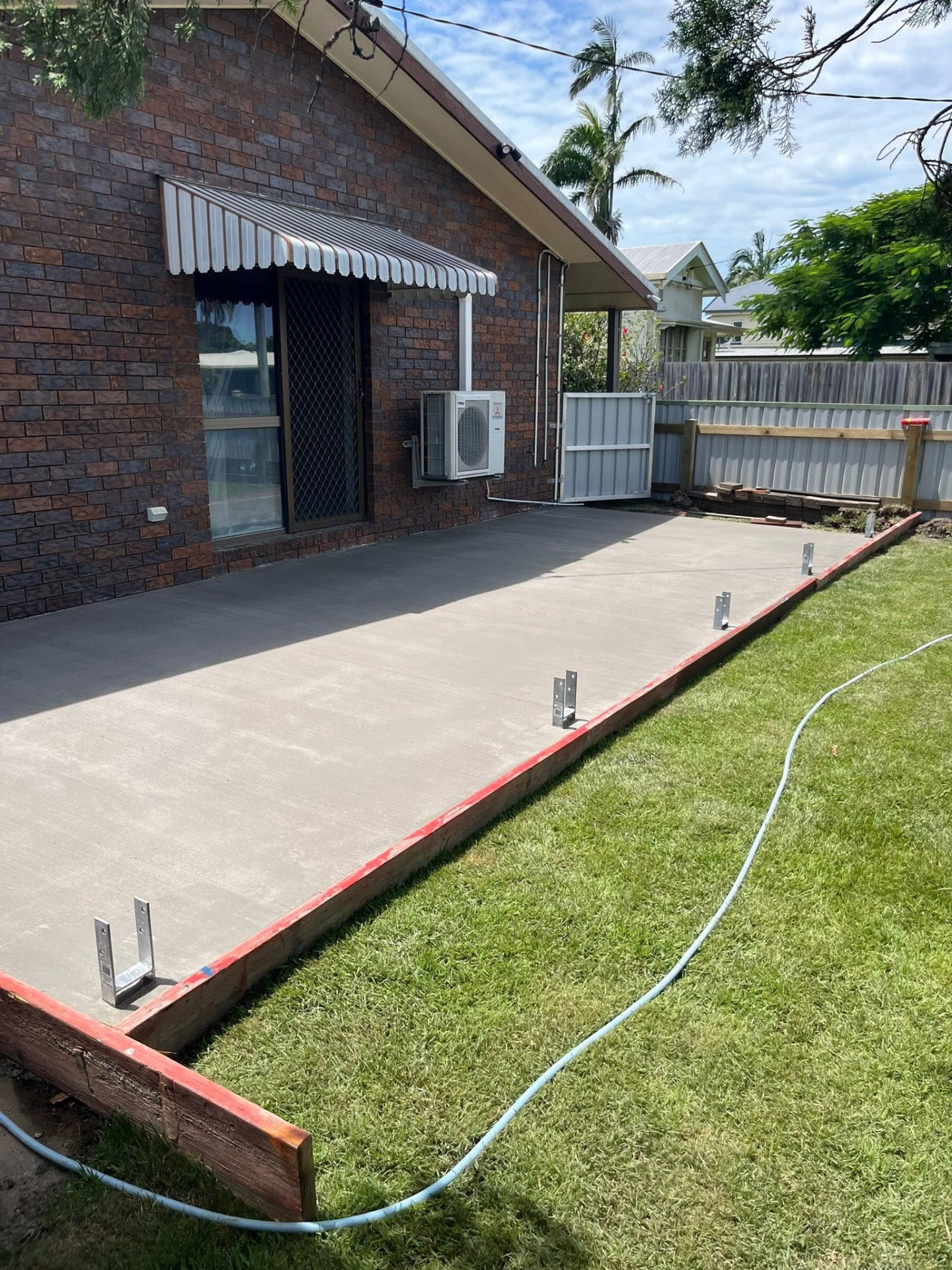 Finished concrete shed slab poured by CJM Outdoor Solutions in Mackay