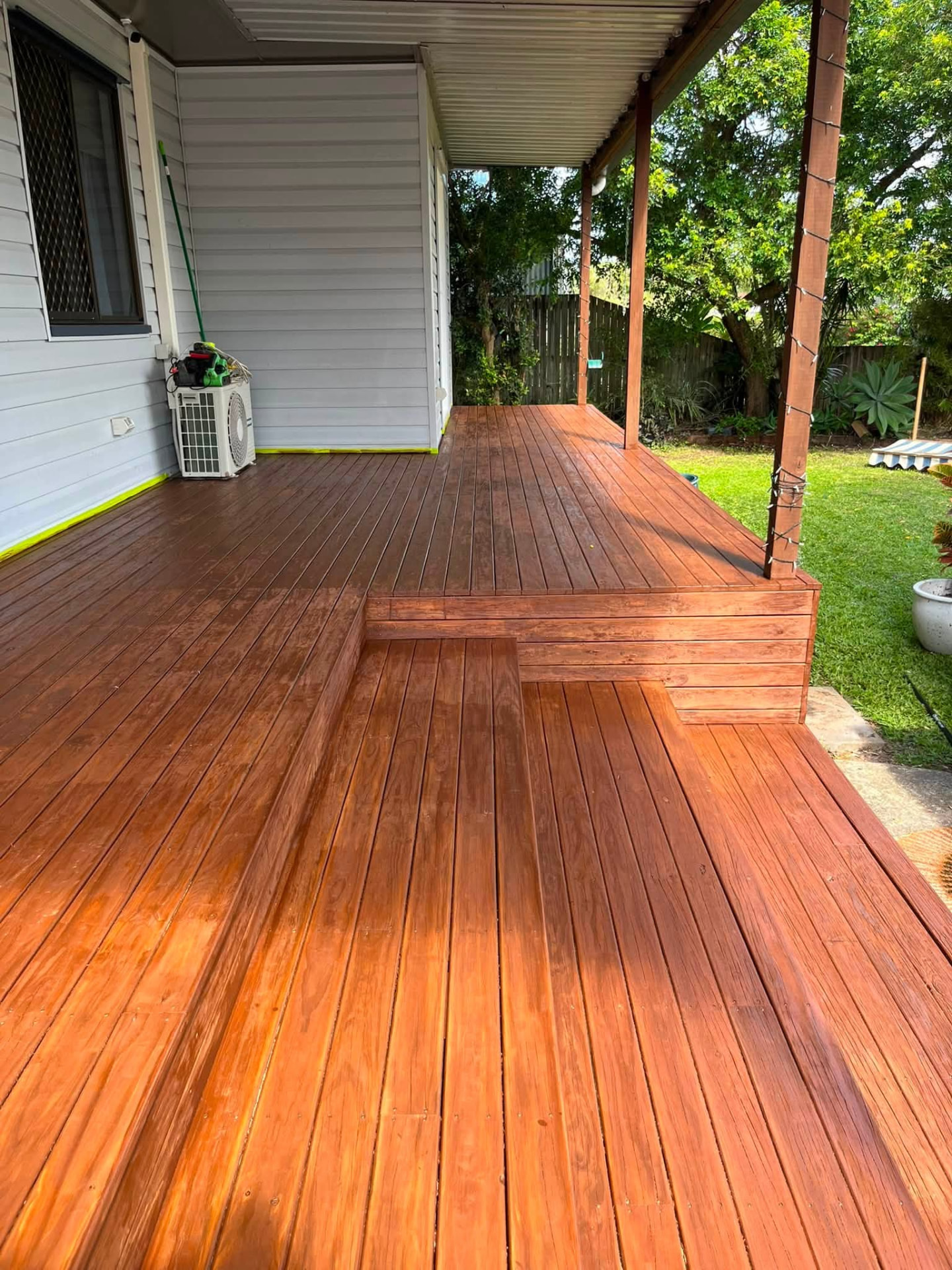 Freshly oiled timber entertaining deck beside a Mackay home